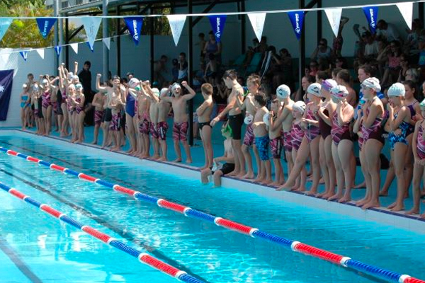 Families at the pool on a busy Friday night